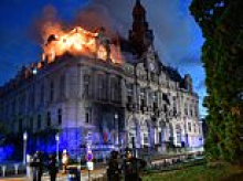Far-left activist known to police is arrested over arson attack that destroyed historic town hall during French riots