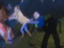 Hero sheriff's deputy filmed jumping into neck-deep pond to rescue non-verbal child who has autism