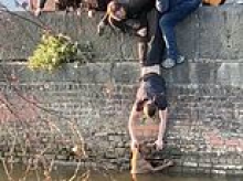 Moment group of strangers come together to rescue dog that fell into Manchester canal