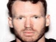 Police officer called to welfare check found a man dead in his home... and then decided to move into the house and take it over, prosecutors allege